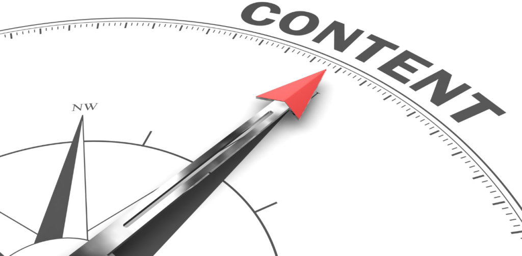 Compass with a red arrow pointing to the word Content, symbolizing content direction and strategy