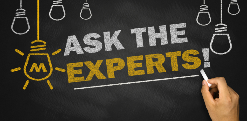 Chalkboard with Ask the Experts! written in bold letters, representing expert-driven engagement in outreach marketing