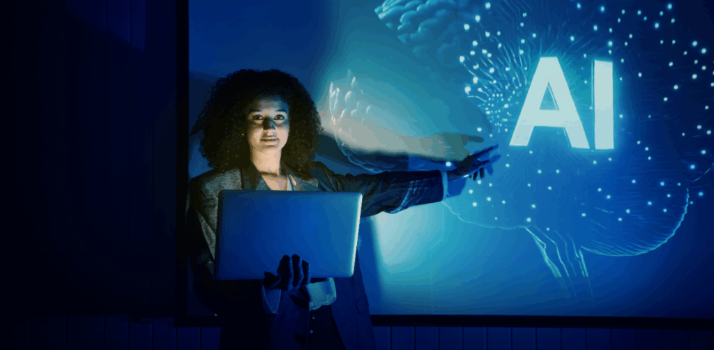 Woman holding laptop points to AI graphic on digital screen in dark room