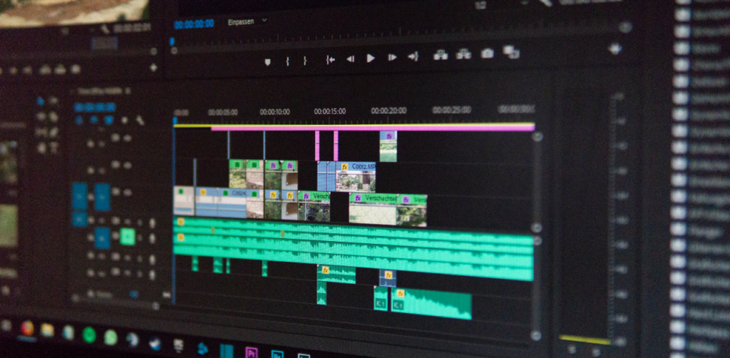 Close-up of video editing timeline on screen, showing clips and audio tracks, representing post-production workflow